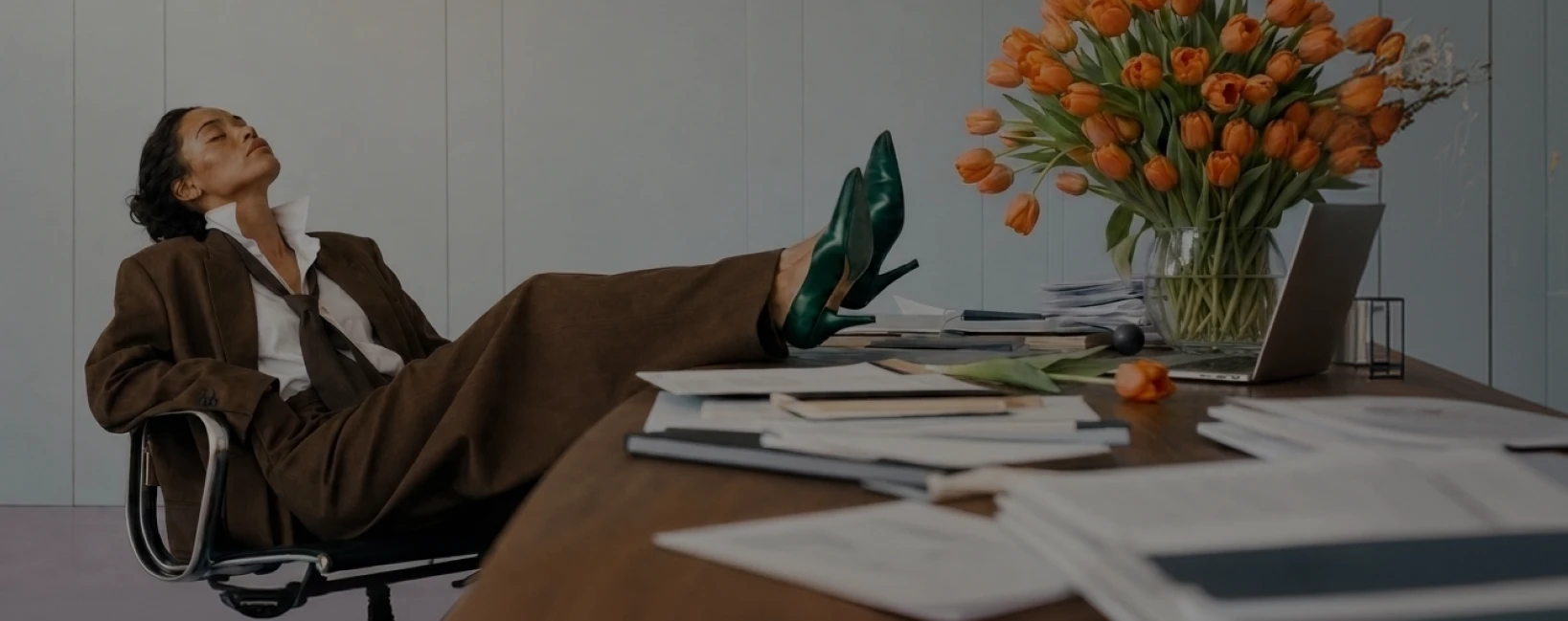 A creative workspace with a person relaxing at a desk, from Pika’s enterprise pricing page